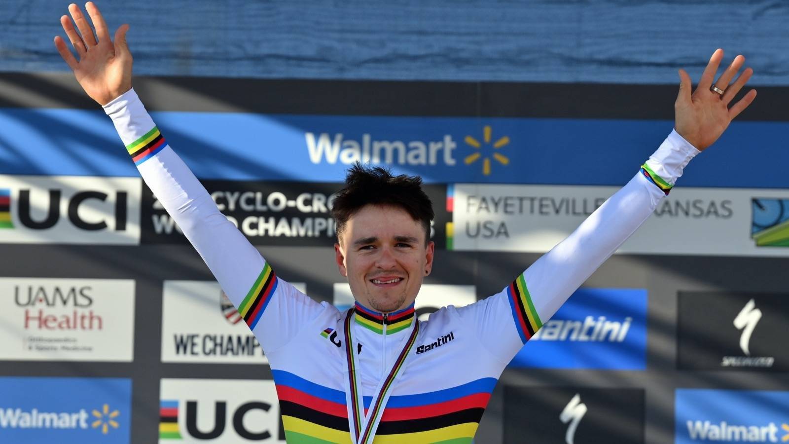 British Thomas Pidcock celebrates on the podium after winning the men's elite race at the World Championship cyclocross cycling in Fayetteville, Arkansas, United States, Sunday 30 January 2022. The world championships are taking place from 28 until 30 January. BELGA PHOTO DAVID STOCKMAN